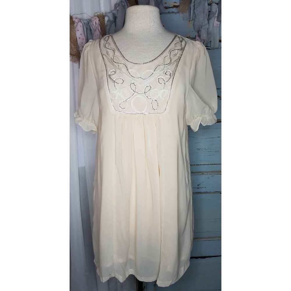 In Vogue Paris designer baby doll dress